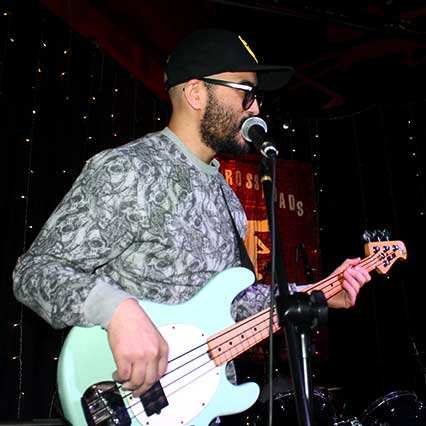 Bass guitar instructor on stage